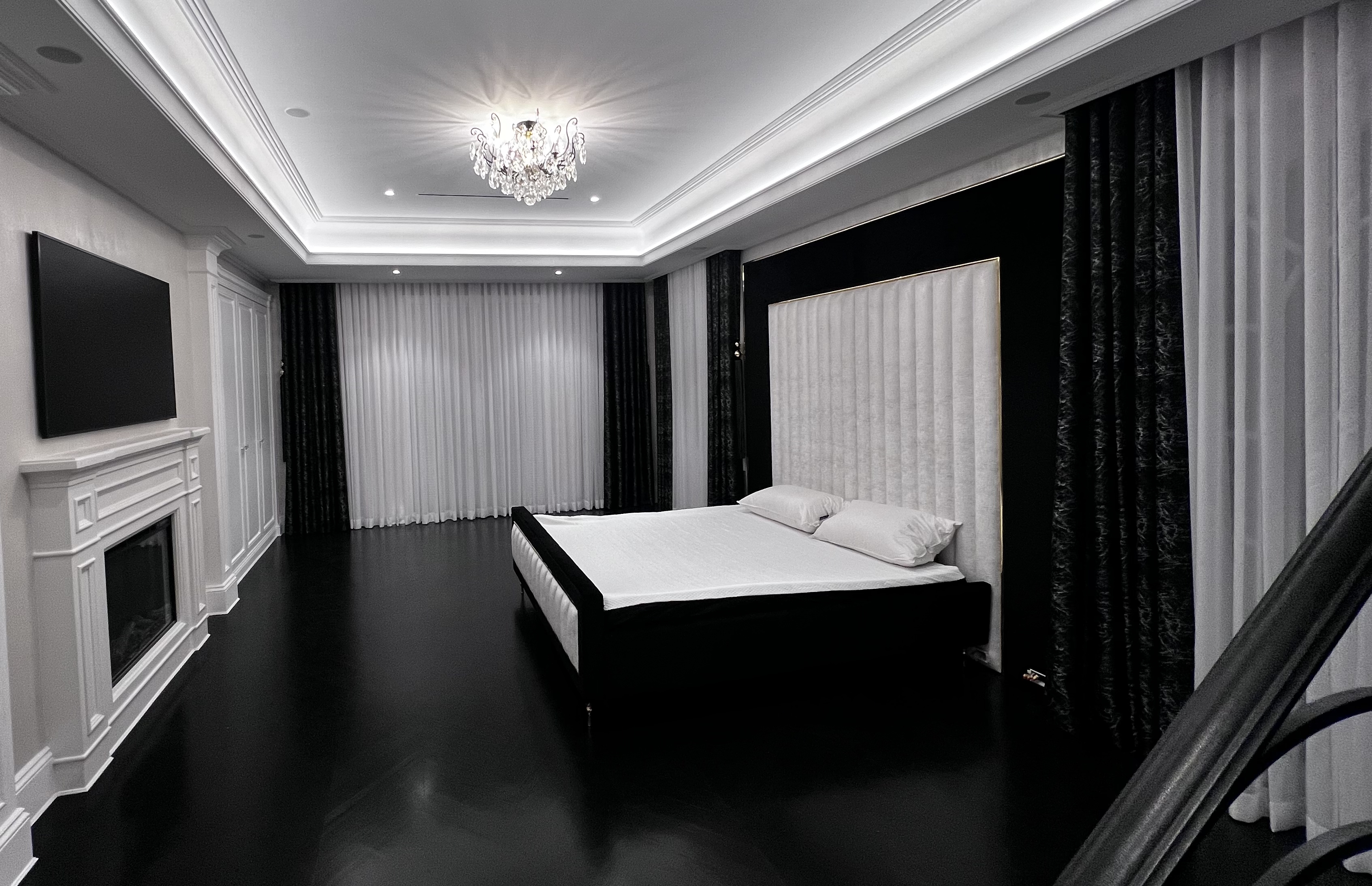custom black and white bedframe and matching curtains