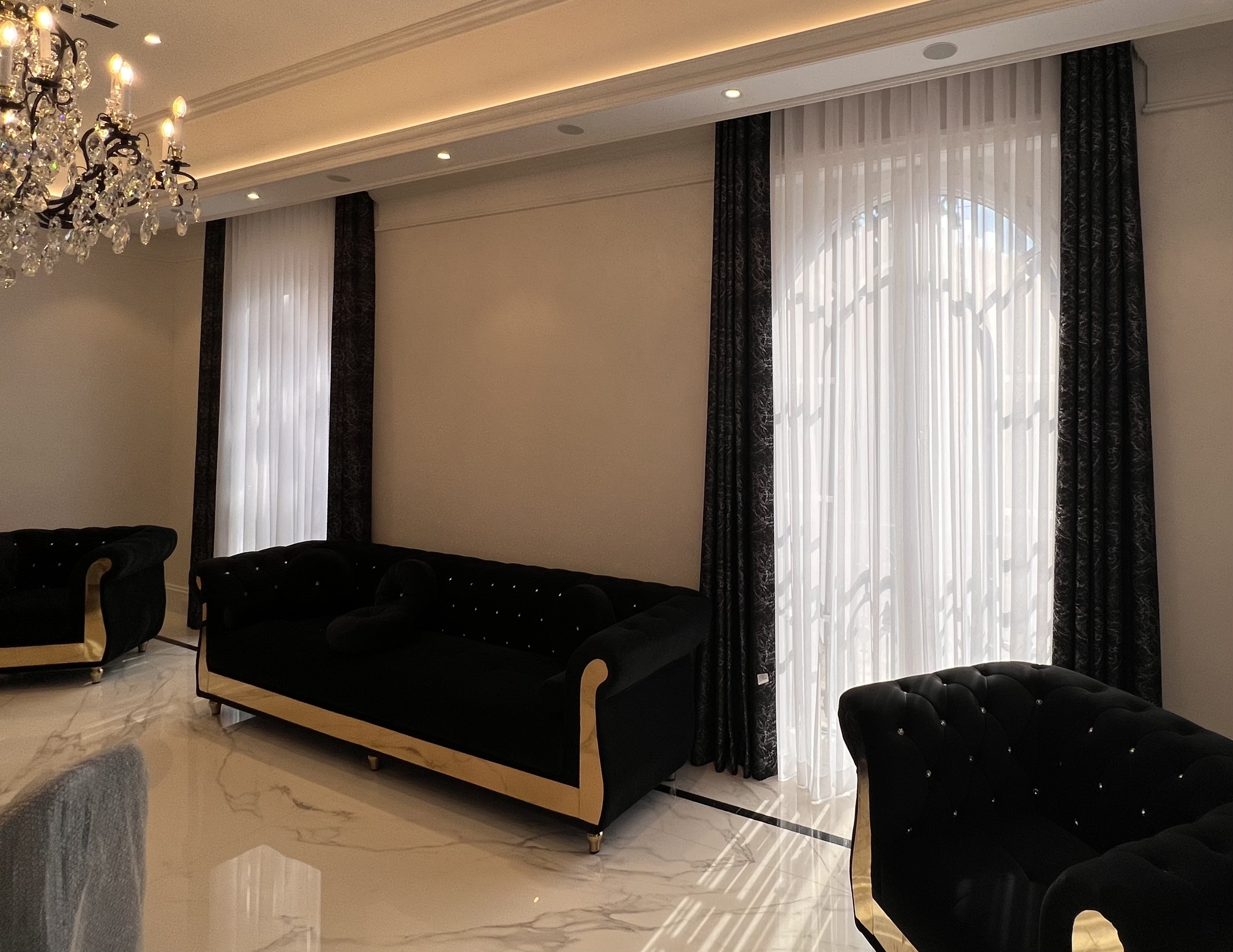 custom black sofa and matching armchairs