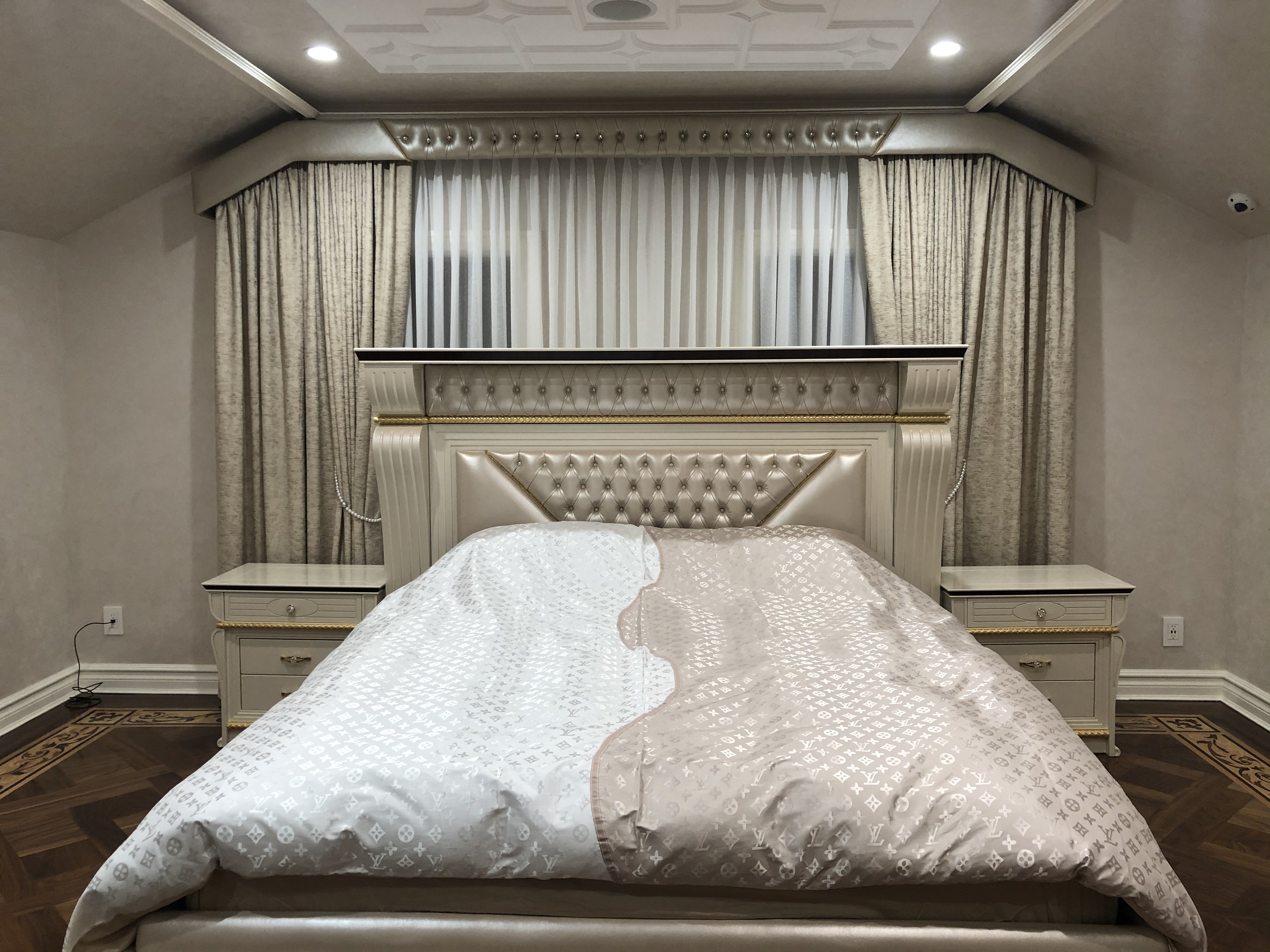 upholstered bedframe and matching curtains with upholstered cornice